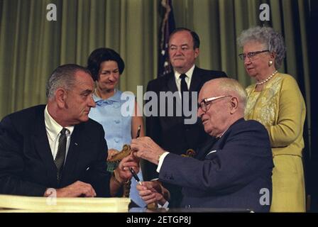 Photograph of President Lyndon Johnson Hands President Harry S. Truman a Pen at the Signing of the Medicare Bill at the Harry S. Truman Library, Independence, Missouri. Stock Photo