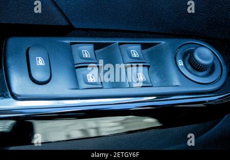 Buttons for adjusting the rise and fall of Windows in the car. Rear window lock button Stock Photo