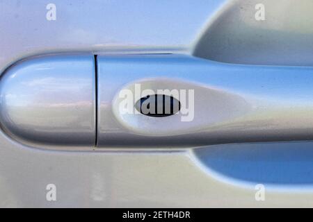 Handle the car with unlock button of the doors. The door handle of the car Stock Photo