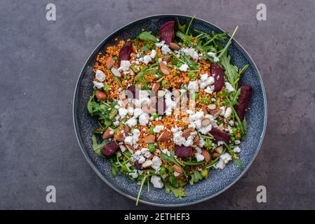 healthy home made couscous salad with sweet potato, beetroot and feta cheese