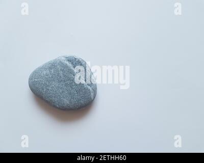 Gray sea pebbles on a white isolated background. Grey sea pebbles Stock Photo