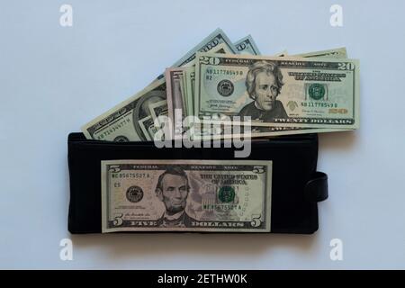 Background of hundred-dollar bills, the texture of dollars. A stack of hundred dollar bills spread out in a circle Stock Photo