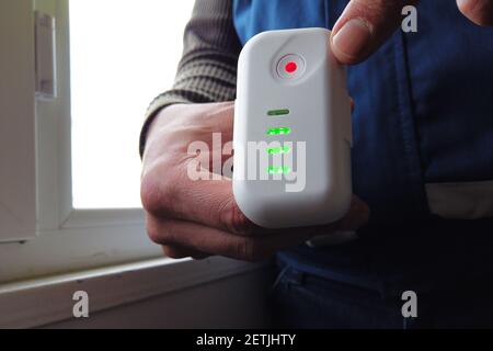 man checking drone battery charge Stock Photo
