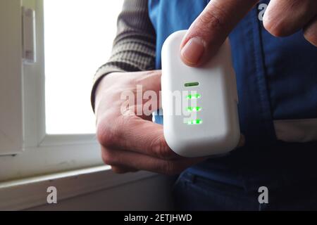 man checking drone battery charge Stock Photo