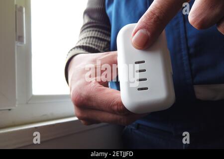 man checking drone battery charge Stock Photo