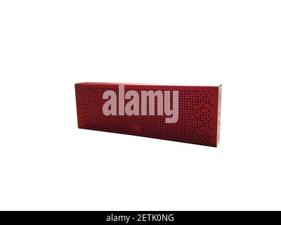 Portable music speaker in red isolated on a white background Stock Photo