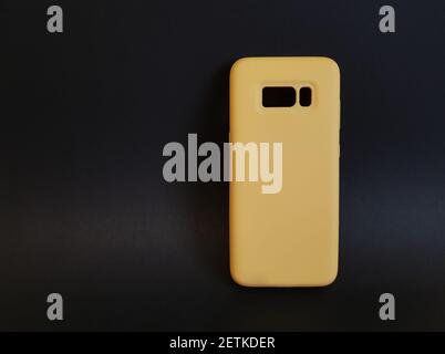 Yellow case on a black isolated background Stock Photo