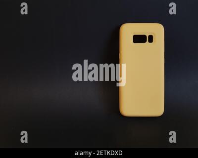 Yellow case on a black isolated background Stock Photo