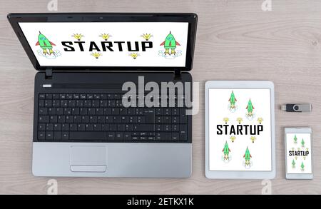 Startup concept shown on different information technology devices Stock Photo