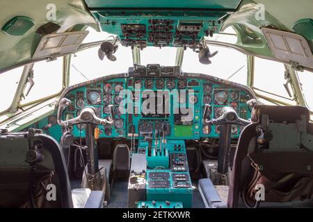 Old Russian airplane cockpit interior with analog instruments Stock Photo