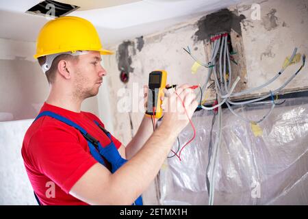 Checking of current distribution system using unimer electrical instrument Stock Photo