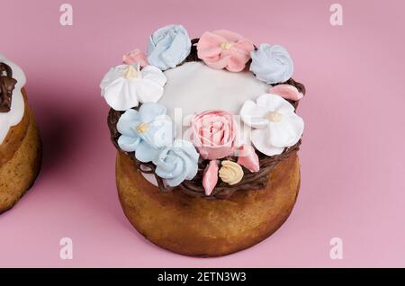 Festive Easter cake with flower decorations on pink background Stock Photo