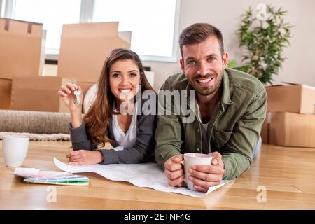 Lovebirds taking a break from unpacking and resting awhile Stock Photo