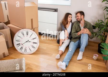 Lovebirds taking a break from unpacking and resting awhile Stock Photo