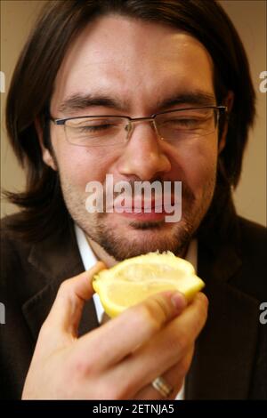 Jerome Taylor tries MIRACLE FRUIT ( Synsepalum Dulcificum) which makes sour and bitter foods taste sweeter.photograph by David Sandison The Independent Stock Photo