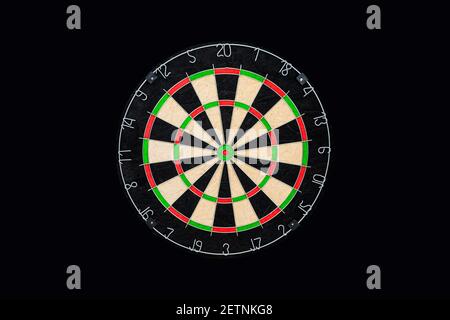 Dartboard isolated on black background. Stock Photo