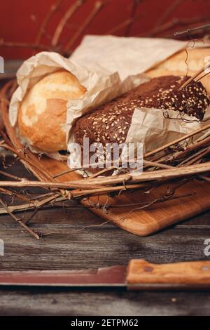 Baking Loaf of Bread Flour Product in a Nest on a Wooden Table