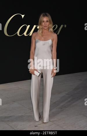 Sienna Miller wearing Cartier jewelry arrives to the Cartier Los