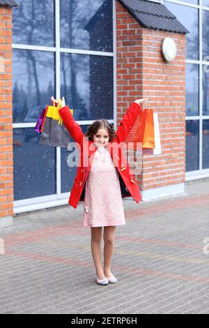 A girl with a lot of packages in her hands. Stock Photo