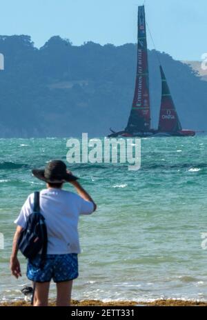 Auckland, New Zealand, 2 March, 2021 -  Emirates Team New Zealand's Te Rehutai, skippered by Peter Burling, practices on Auckland's Waitemata Harbour watched from the beach. Credit: Rob Taggart/Alamy Live News Stock Photo