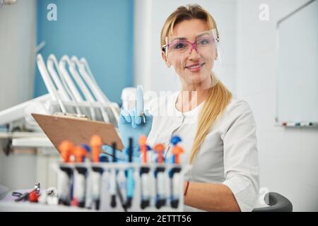 Dental practitioner asking to pay attention to important information Stock Photo