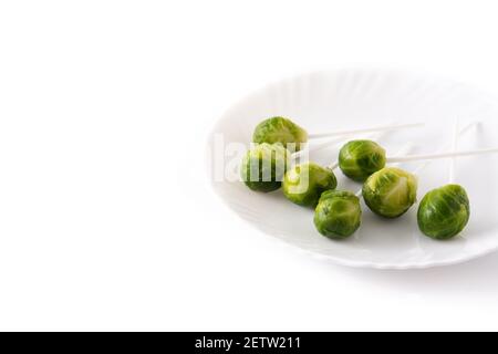 Set of brussel sprouts with lollipop sticks on white background Stock Photo