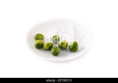 Set of brussel sprouts with lollipop sticks on white background Stock Photo