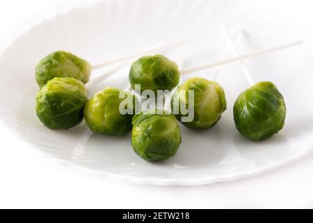Set of brussel sprouts with lollipop sticks on white background Stock Photo