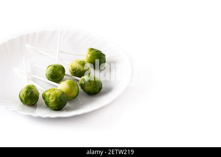 Set of brussel sprouts with lollipop sticks on white background Stock Photo
