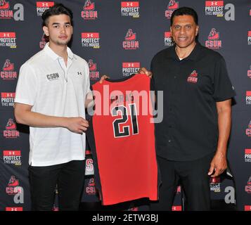 R L CSUN Men s Basketball Coach Reggie Theus welcomes Filipino Sensation Guard Kobe Paras with his 21 Matadors jersey at a Press Conference held at The Metadome in Northridge CA on Wednesday May