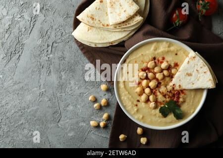 Concept of tasty eat with hummus and pita, space for text Stock Photo