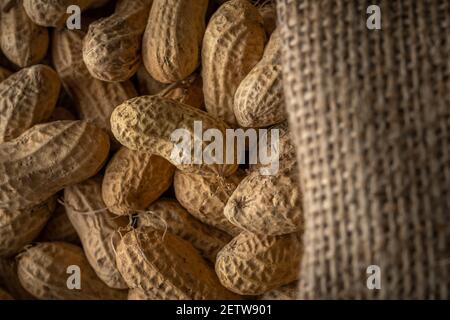 Close-up view of peanut in sack bag. Food background. Stock Photo