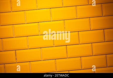 Yellow, glossy ceramic floor tile brick wall texture background. Stock Photo