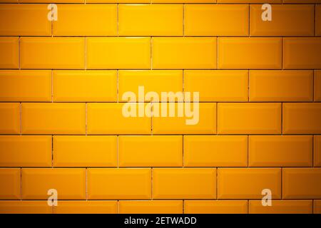 Yellow, glossy ceramic floor tile brick wall texture background. Stock Photo