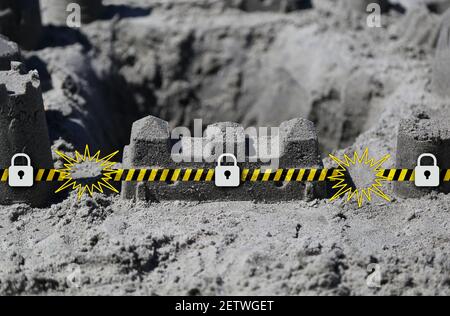 Beach sand castle security wall metaphor protecting computer and networks from virus and malware threats Stock Photo