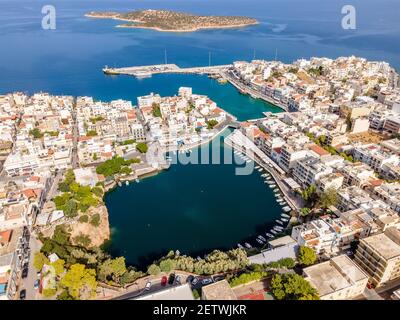 Aerial top view by drone of Agios Nikolaos city. Greece, Crete. Stock Photo