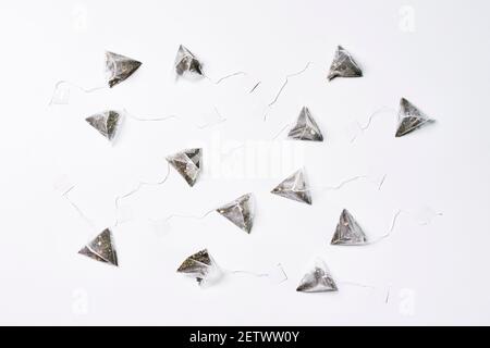 A group of tea bags on white background Stock Photo