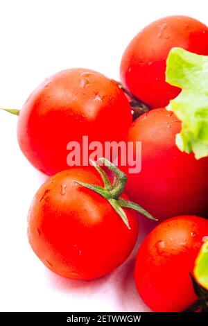 Cherry tomatoes isolated on white. High quality photo. Stock Photo