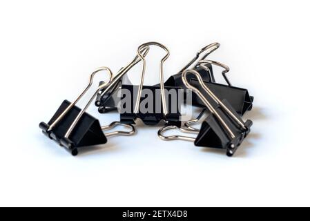 Black paper clips isolated on white background Stock Photo