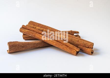 Cinnamon sticks isolated on white background, Cinnamon aroma spice pile Stock Photo