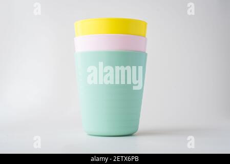 Plastic cups isolated on white background, Kids colorful plastic cups Stock Photo