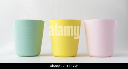 Plastic cups isolated on white background, Kids colorful plastic cups Stock Photo