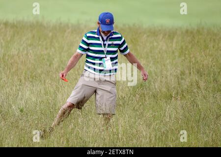 Jun 14, 2017; Erin, WI, USA; A marshall tries to find a ball on the 11th fairway in the tall fescue grass during a practice round of the U.S. Open golf tournament at Erin Hills. Mandatory Credit: Geoff Burke-USA TODAY Sports *** Please Use Credit from Credit Field ***