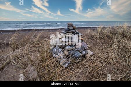 Stone cairn at Lildstrand beach in western rural Denmark Stock Photo