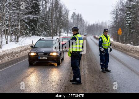 Finnish Police officers breathalysing drivers at random on the main road in north Finland Stock Photo