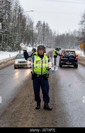 Finnish Police officers breathalysing drivers at random on the main road in north Finland Stock Photo