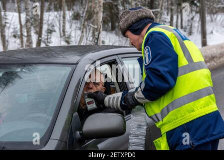 Finnish Police officers breathalysing drivers at random on the main road in north Finland Stock Photo