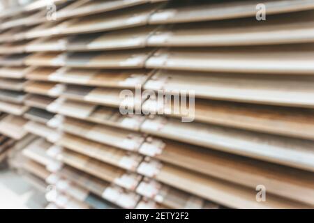 Samples of wooden floor laminate and parquet in the store blurred background. Blurred wooden floor background. Stock Photo