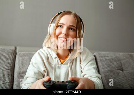 Happy and Beautiful Blonde Gamer Girl Playing Online Video Game on Her  Personal Computer Stock Photo by kjekol