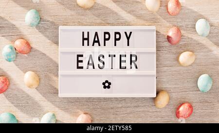 Easter eggs and cinema lightbox with holiday greeting Stock Photo